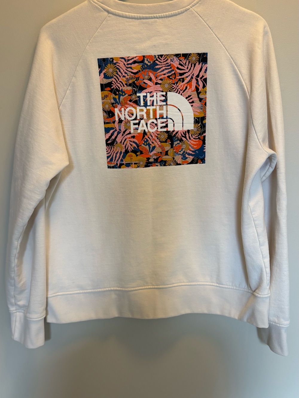 The North Face White Crewneck Sweatshirt with Multicolor Floral Logo